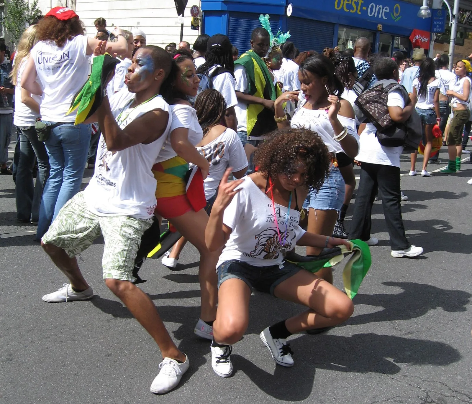 Black women dancing together in a sound-system crowd at Notting Hill Carnival