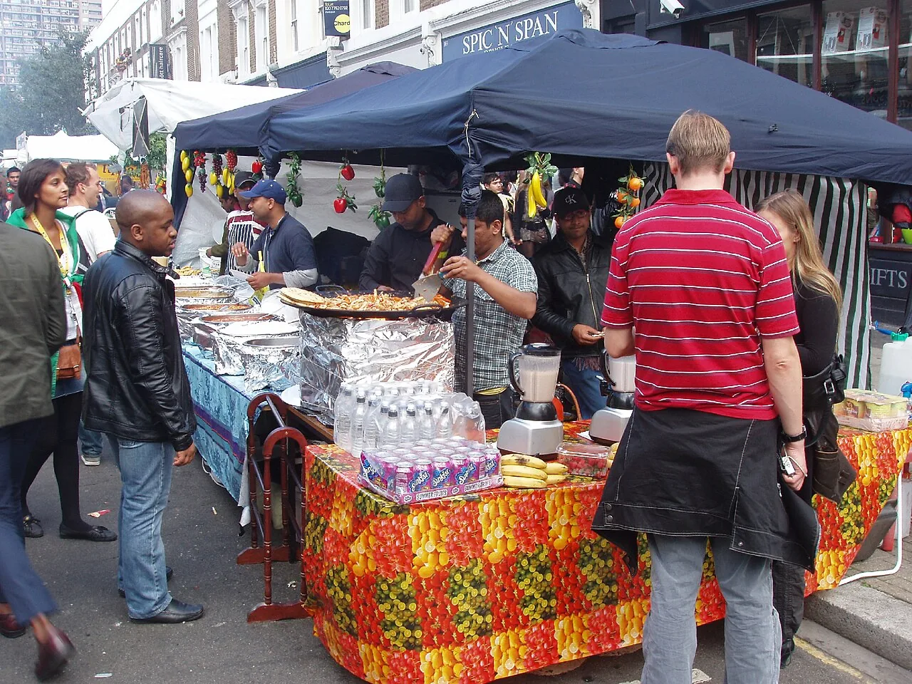 A Caribbean food and drink stall serving customers at Notting Hill Carnival