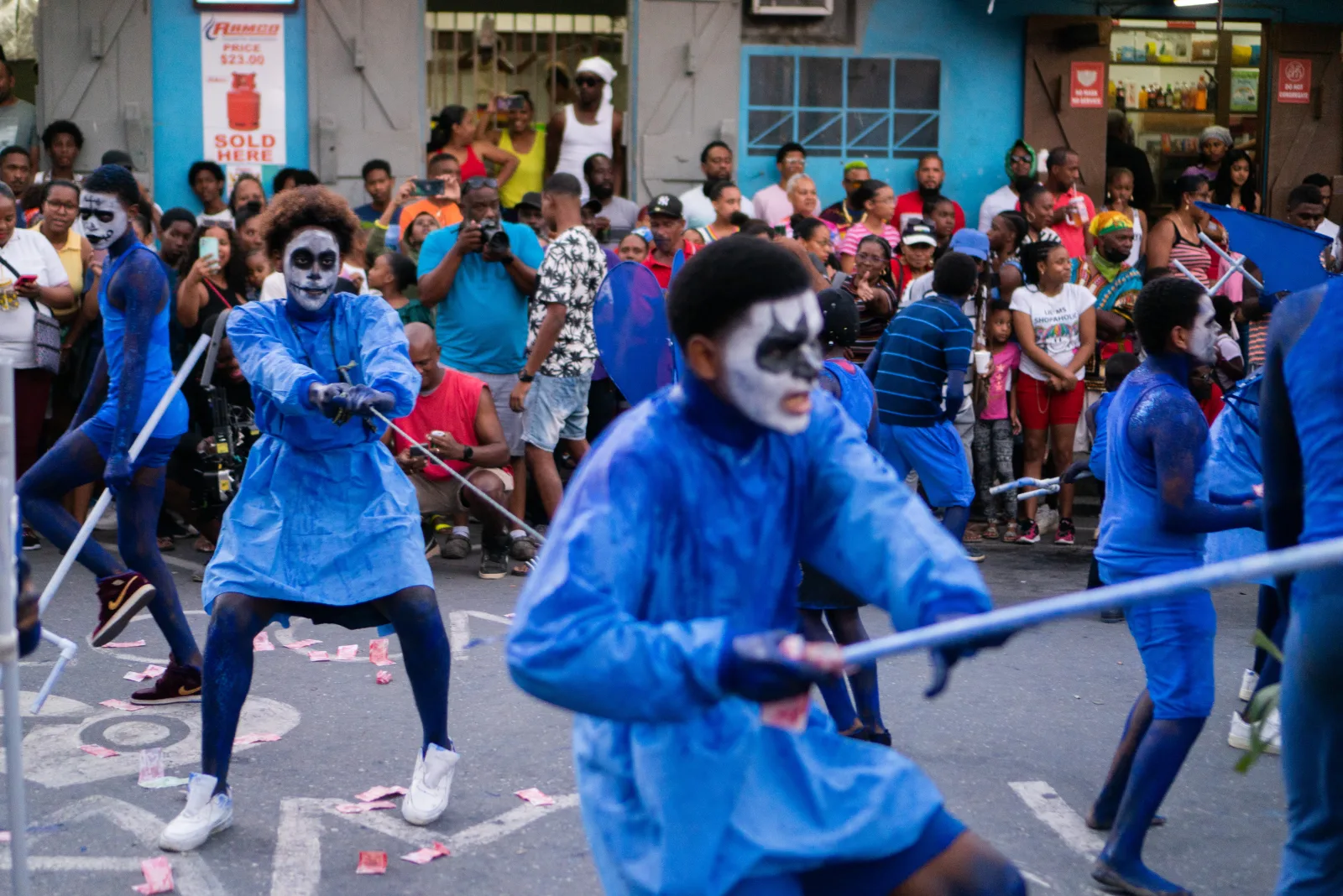 Young Blue Devil performers in blue costumes and face paint during Junior Jab in Paramin, Trinidad