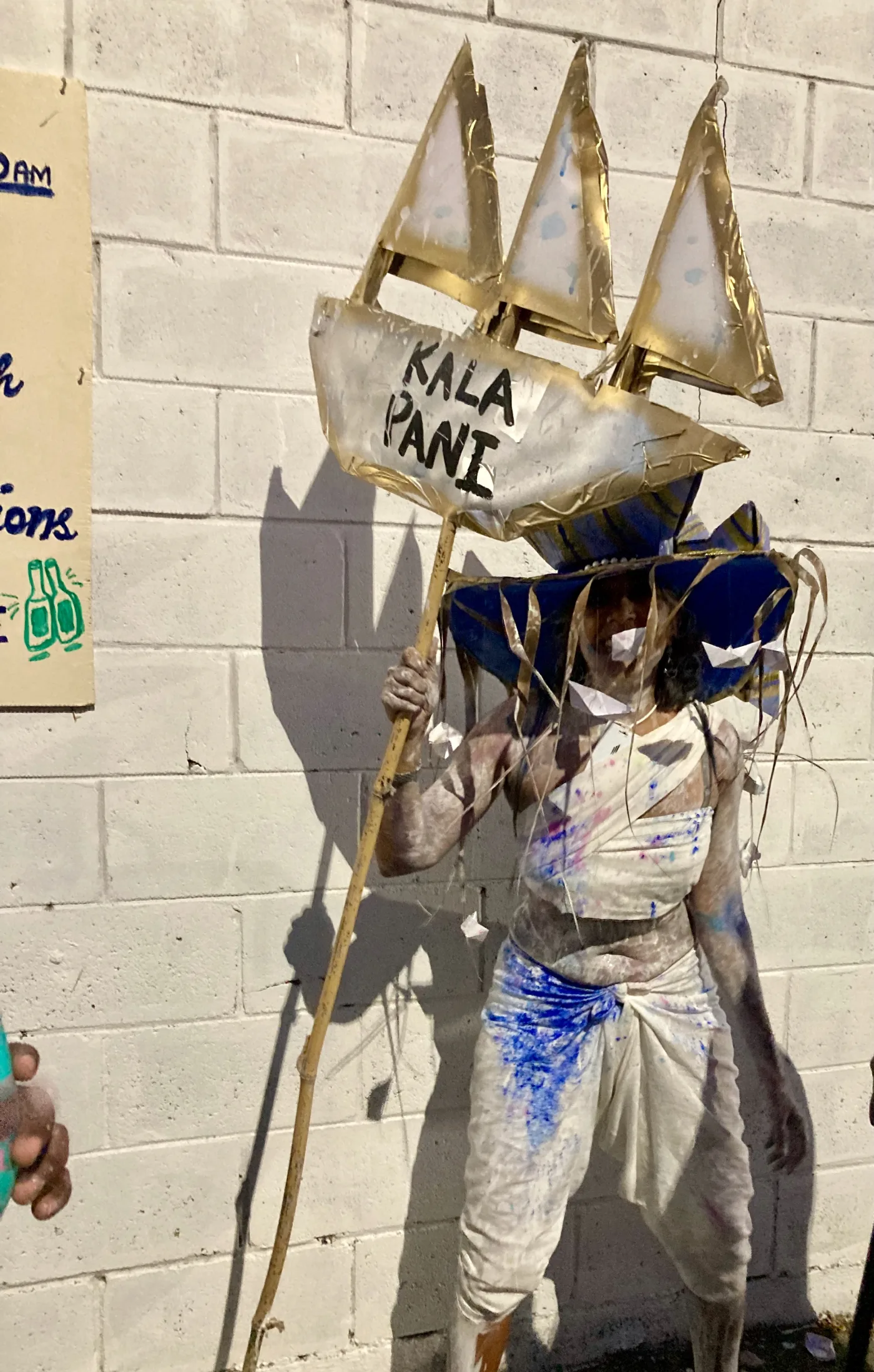 Gabrielle Hosein playing a white and blue Midnight Robber character at Trinidad J’ouvert