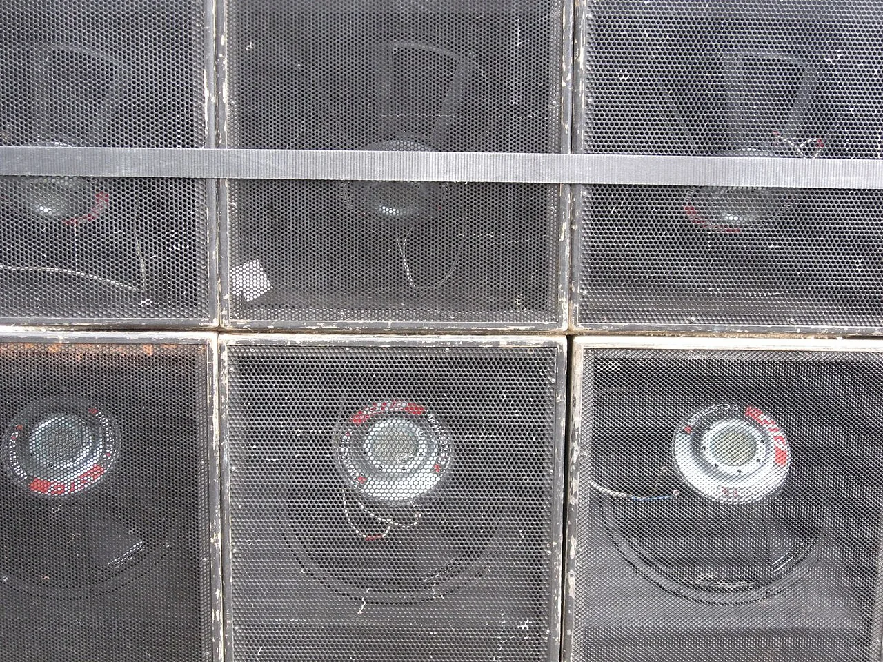 The rear of a Carnival sound-system stack showing drivers, wiring and hand-built speaker cabinets